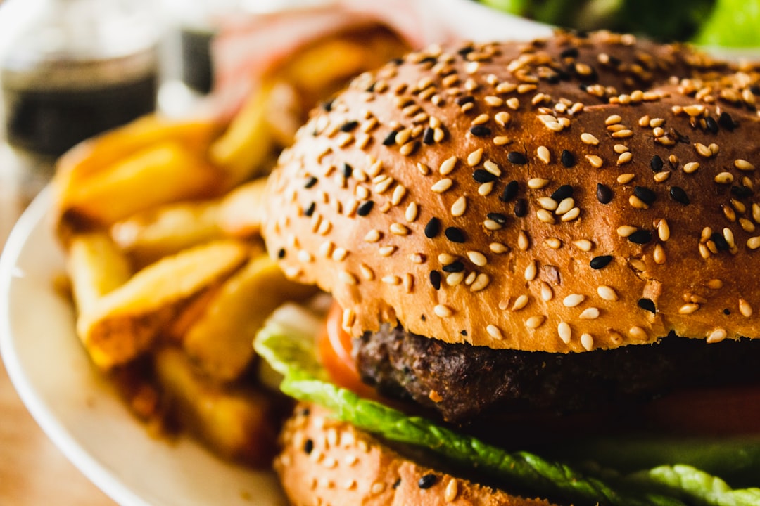 burger with fries on plate